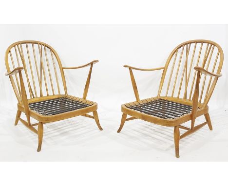 Two Ercol beech framed stick back chairs