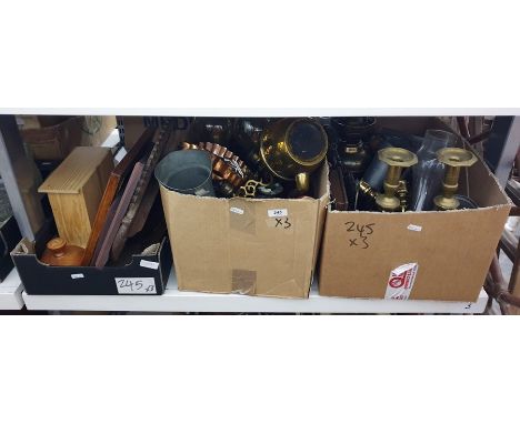 Three boxes of copper and brassware including candlesticks, oil lamps, toasting forks, some prints and a little wooden chest 