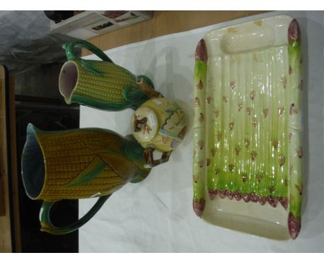Group of English majolica and majolica-style wares to include two corn cobb-moulded jugs, an aesthetic movement teapot and co