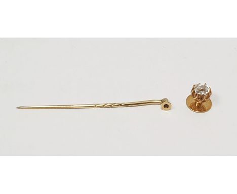 Gold-coloured metal tie stud with stickpin attachment set with old cut cushion-shaped rounded rectangular stone in raised cla