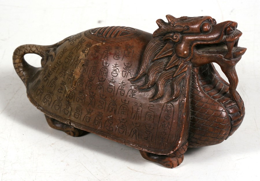 A Chinese carved soapstone figure of a dragon turtle with multiple ...