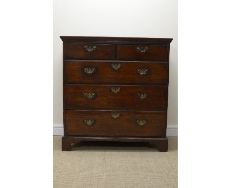 A 19th Century elm Chest of two short and three long graduated drawers on bracket feet