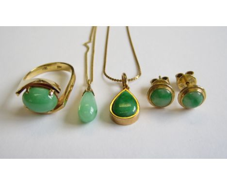 A Jade Ring claw-set oval cabochon in 14ct gold, ring size J, two Jade Drop Pendants on fine chains and a pair of Jade Ear St