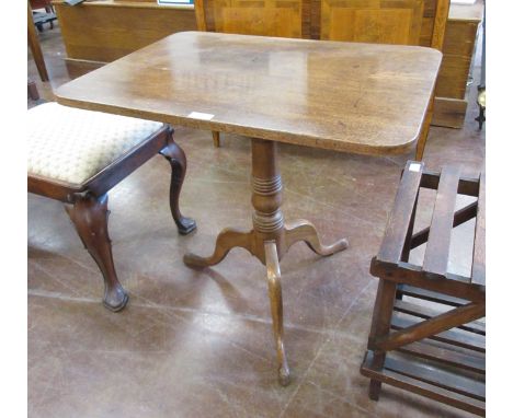 A 19th Century mahogany Pillar Table, the rectangular hinged top above a turned column on tripod supports, 22 x 30in