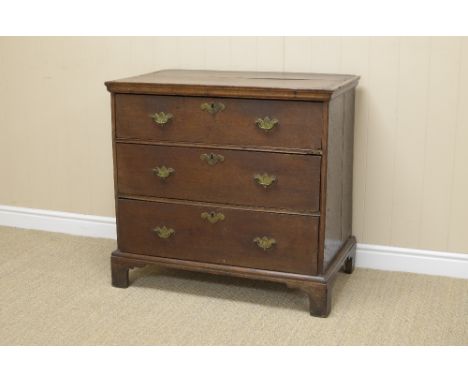 An 18th Century oak Chest with cross-banded top above three long drawers on bracket feet, 2ft 11in