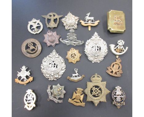 Approximately twenty British Army Cap badges including Corps of Commissionaires, Argyll and Sutherland Highlanders, Royal Arm