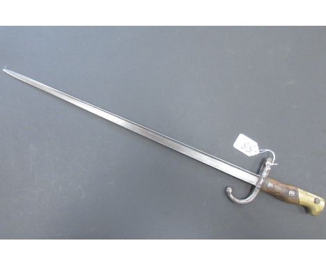 A French 1874 Pattern bayonet stamped 5168, a US Army First Aid kit and a box of military manuals and ephemera