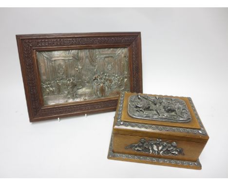 An oak two division Tea Caddy with applied plated mounts of lion hunting, 9in and an oak framed plated Plaque of figures in b
