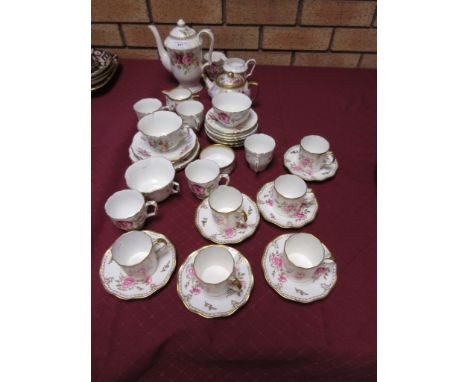 A Crown Staffordshire Coffee Service, viz: Coffee Pot, Cream Jug and Sugar Basin, six Cups and Saucers, all pink roses, Hamme