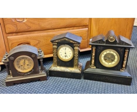 A black slate and marble mantle clock together with a metal mantle clock with French movement.