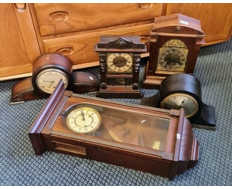Four wood cased mantle clocks together with a oak wall clock.