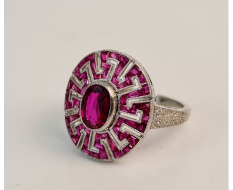 A stamped PLAT ruby cluster ring, with diamond accents to shoulders, ( heat treated), ring size M