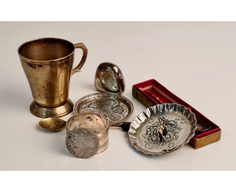 A collection of white metal to include child's tankard, napkin ring, pin dish, patterned dish (made in Iran), cow bell two sp