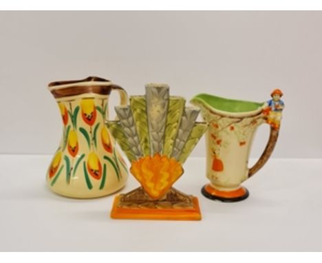 Two hand painted Myott pottery water jugs and one fan vase.