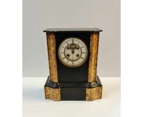 A black slate and marble visible escape movement mantle clock stamped LB 869 height 31 1/2 cm.