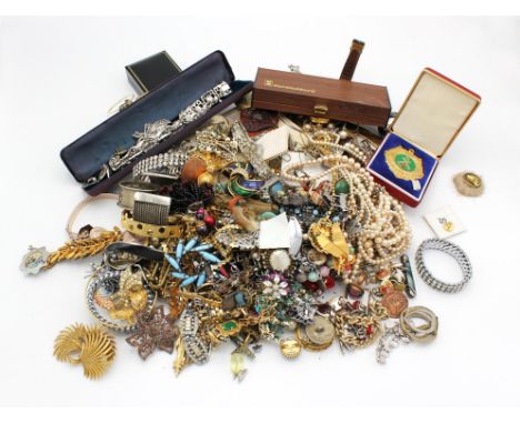 A large group of costume jewellery including a silver hinged bangle with safety chain, an onyx and silver pendant with chain,
