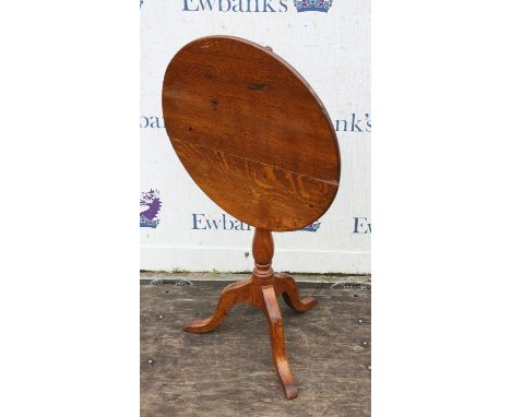 A Victorian oak tripod table, the triple plank tilt-top on a baluster stem and three cabriole legs, H 72cm, diam. 62cm 