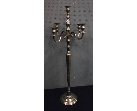 A silver metal five light floor standing candelabra, 144 cm high.