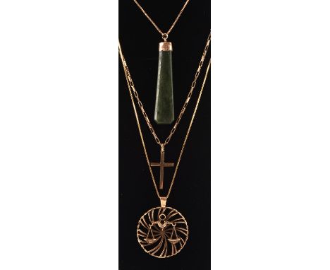 Three gold pendants, including a nephrite jade pendant, in 9 ct hallmarked Birmingham 1909, on a silver gilt box link chain, 