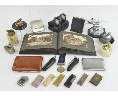 A quantity of collectables including ; an Art Deco table lighter modelled as a jet aircraft, a collection of BT phone cards, 
