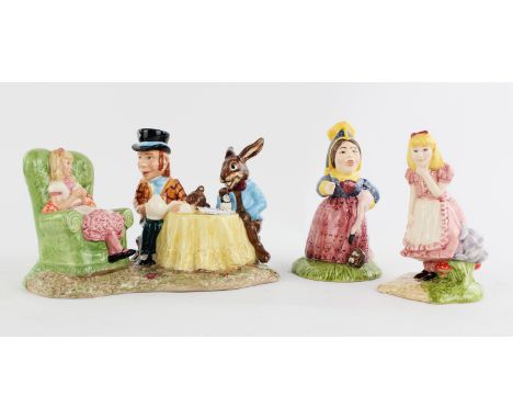 A Royal Doulton/Beswick figure group of the Mad hatters tea party, together with a similar model, number 1592 and 1261, both 