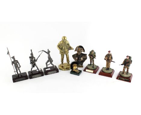 A cast brass model of a British paratrooper, together with three modern military figure models of soldiers, to include two Pa