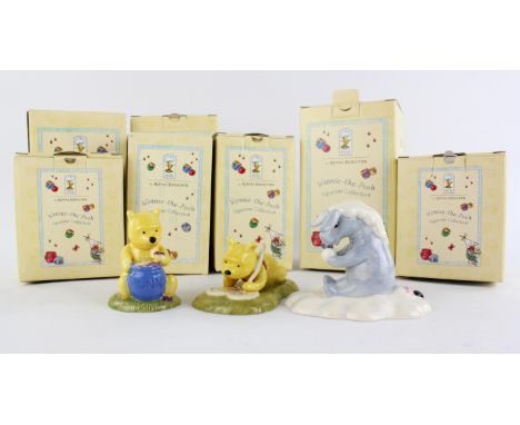 A collection of classic Pooh ceramic figures, by Royal Doulton to include, A little tree trimming is in order, Summer is full