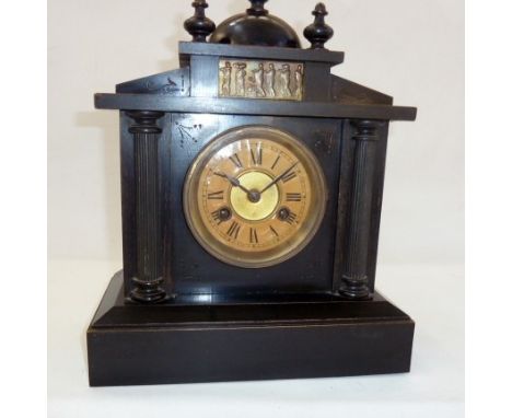 A 20th Century ebonised wooden mantel clock, with frieze decorated with figures, Roman numeral dial, 37cm high approx.&nbsp;