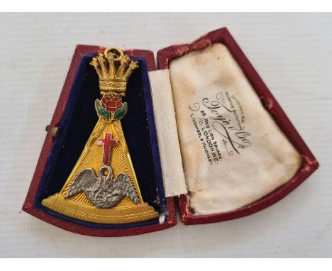 A gold coloured masonic medal, in the shape of a drawing compass, crown finial, one side with enamel red rose, cross and bird