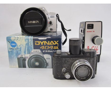 A quantity of cameras and accessories to include a Minolta 404si camera and lens, a Carl Zeiss Jena Biotar no.2517202, an ELF