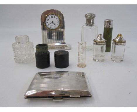 1930s silver rectangular cigarette case initialled BCF, 2oz, a silver mounted mantel clock, a silver lidded scent bottle, sil