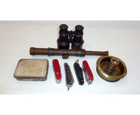 A pair of binoculars, assorted penknives, extending telescope, brass candlestick and a tin (one box)