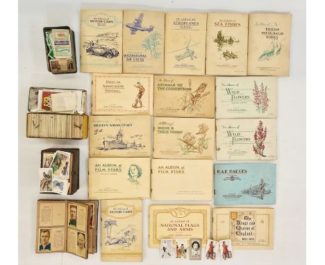 A quantity of cigarette cards, some in albums and loose, Wills, Players, etc (2 boxes)