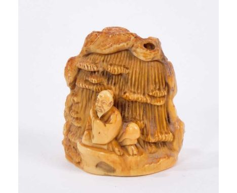 19th century carved ivory netsuke, in the form of a mountainous outcrop with farmer and buffalo to one face, the reverse with