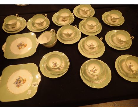 Foley green floral tea service including twelve trios  CONDITION REPORT: No visible crack chips or restoration 