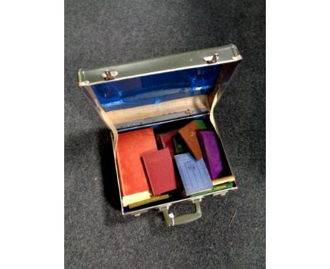 A 20th century vintage luggage case containing assorted antique and later books, poetry etc 