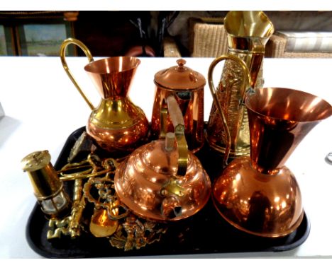 A tray of brass and copper jugs and teapots, coffee pot, brass embossed jug, set of graduated brass keys, miniature miner's l