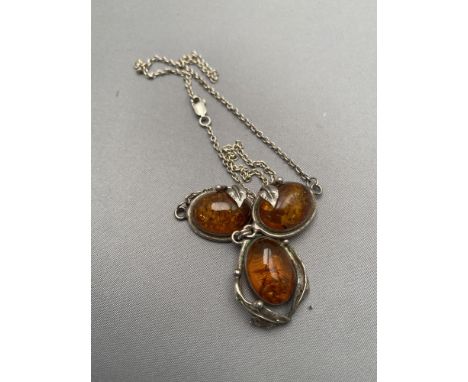 A vintage silver and amber necklet 