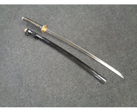 A reproduction Japanese katana in scabbard 