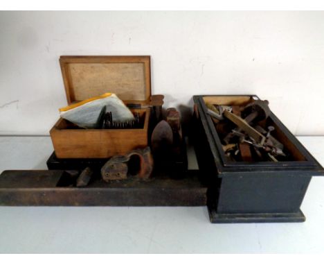 Two vintage wooden boxes containing horology tools, hand tools, cobbler's last, wooden block plane 