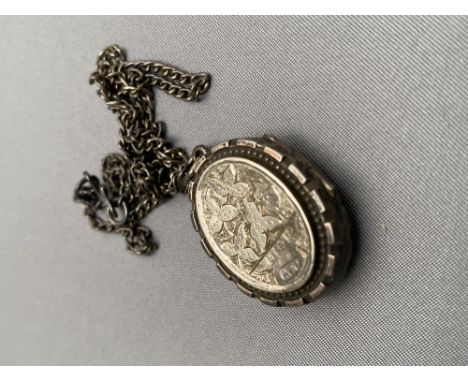 A vintage silver locket on chain 