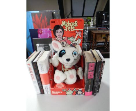 A tray of six books relating to Michael Jackson one signed by Germaine Jackson, 20th century Ideal Michaels Pets plush toy - 