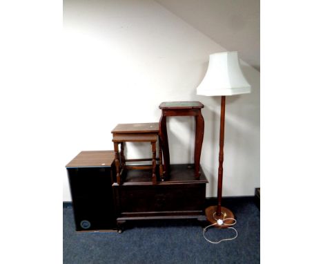 An oak blanket box, occasional table, hi/fi cabinet, standard lamp and a nest of two oak tables 