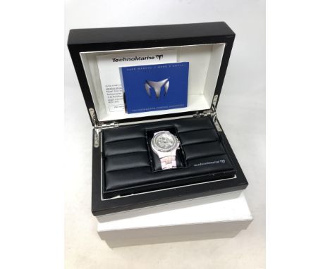 A lady's Technomarine diamond set ceramic and stainless steel wristwatch, boxed with documentation. 