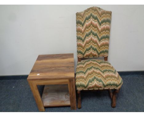 A continental beech framed high back chair upholstered in a tapestry fabric, together with a two tier lamp table in a walnut 