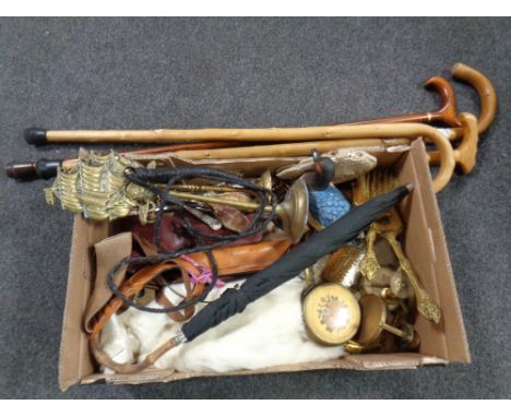 A box of miscellany to include leather holsters, walking stick, brass ware, dressing table set, mink fur coat