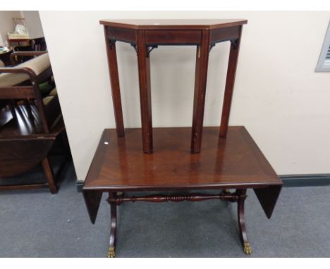 A mahogany flap sided sofa coffee table on brass capped feet together with a shaped hall table 