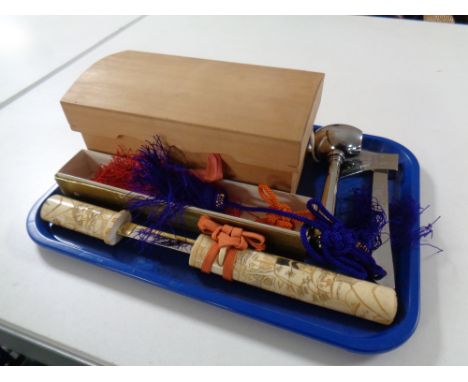 A Japanese knife with a carved resin handle and sheath, pine domed topped box containing ceremonial hammer and axe  