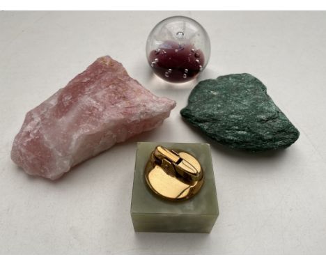 Two pieces of rock crystal together with an onyx table lighter and a paperweight 