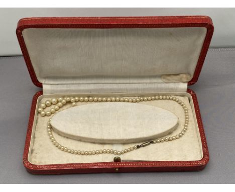 A vintage pearl necklace in box